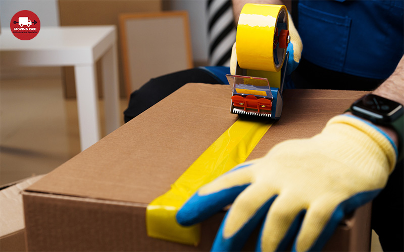 Image of a man packing a box