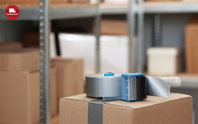 A box with a roll of tape on it in a short-term storage facilities