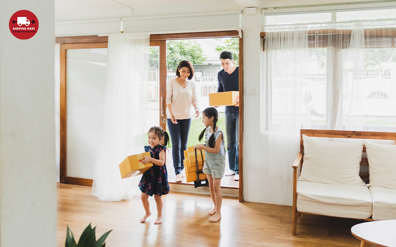 Family entering their new house after residential moving